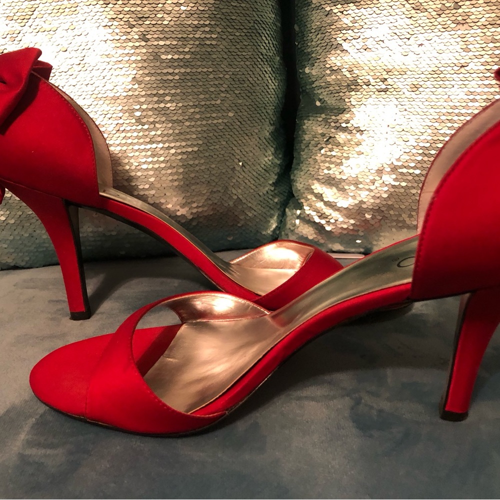 Sexy red satin heel barely worn. Great condition